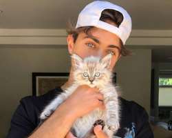 He is a cat lover and has also adopted one in his home.